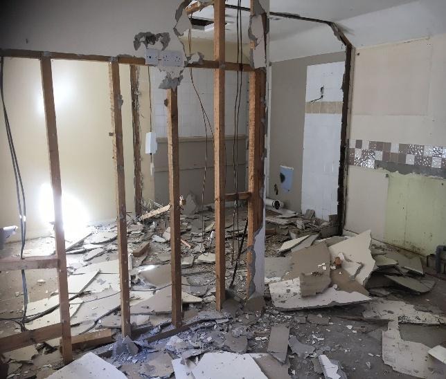 A room with debris in itDescription automatically generated